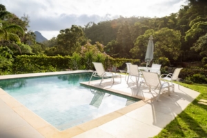 Beautiful-landscaping-surrounds-a-private-swimming-pool Beautiful landscaping surrounds a private swimming pool